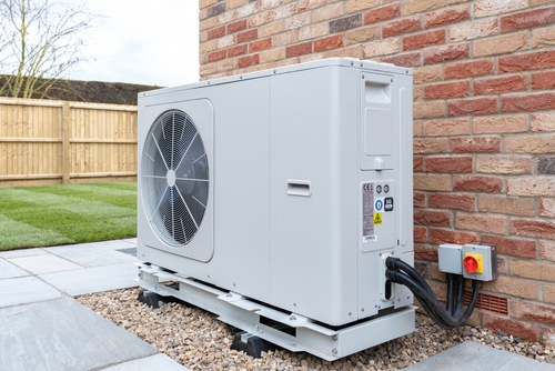 A Picture of a fully installed outdoor heat pump